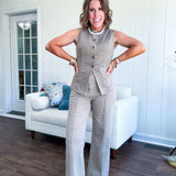  This mocha button-down denim vest is your new styling secret—pair it solo with our matching wide-leg pants for effortless sophistication, or throw it over a mesh tee and your go-to denim for that perfectly curated vibe. The antique bronze buttons and faux front pockets add just enough edge to keep things interesting, while the soft cotton-blend fabric moves with you. True to size, minimal stretch, maximum impact.