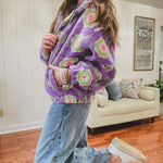 Medium wash barrel jeans with a wide leg flare and button fly.