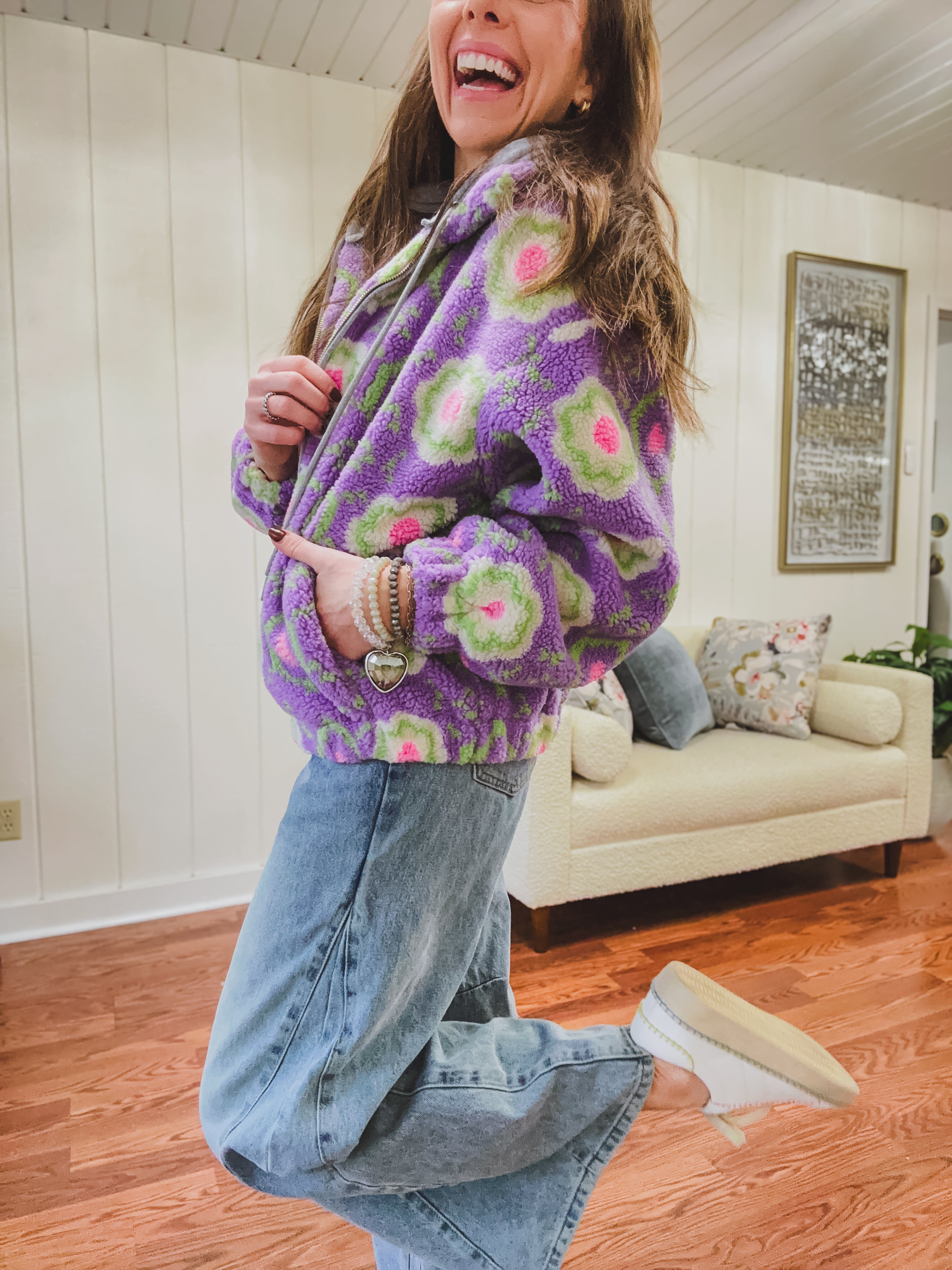 Medium wash barrel jeans with a wide leg flare and button fly.