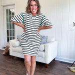 Black and cream striped short sleeved mini dress with green crochet trim at the shoulders. Has pockets.
