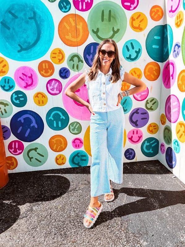 A crisp white twill vest that's equal parts polished and playful—those ruffled sleeves are the kind of detail that makes every outfit feel intentional. Button-down front, collar, and functional pockets.