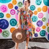 This tropical print short dress features vibrant summer hues with playful striping and fruit motifs throughout, square smocked neckline and flutter sleeves and pockets—complete with pink and blue ball tassels. Crafted from soft, lightweight fabric, it's designed to move with you all day long.