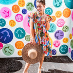 This tropical print short dress features vibrant summer hues with playful striping and fruit motifs throughout, square smocked neckline and flutter sleeves and pockets—complete with pink and blue ball tassels. Crafted from soft, lightweight fabric, it's designed to move with you all day long.
