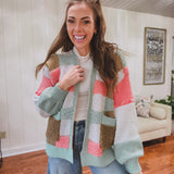 Mixed textured open front cardigan in sage, coral, taupe and ivory checkered pattern with pockets.