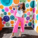 hot pink leopard print pops against a soft pink backdrop, while the cropped wide-leg silhouette keeps things fresh and fashion-forward. Double button and zipper closure, front and back pockets