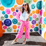hot pink leopard print pops against a soft pink backdrop, while the cropped wide-leg silhouette keeps things fresh and fashion-forward. Double button and zipper closure, front and back pockets