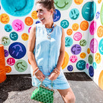 light-washed denim mini dress, lightweight lyocell fabric with front pocket detail and  hook-and-eye back closure.