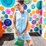 light-washed denim mini dress, lightweight lyocell fabric with front pocket detail and  hook-and-eye back closure.