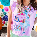 Cool pink cotton sleeveless tee with a shorter hemline with "Be Salty Stay Lit" multi colored retro inspired graphic on the front.