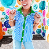 Lightweight cotton blue and white striped flutter sleeve top with button down front and green trim at the collar and placket.