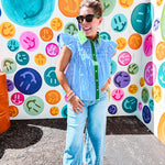 Lightweight cotton blue and white striped flutter sleeve top with button down front and green trim at the collar and placket.