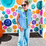 Lightweight cotton blue and white striped flutter sleeve top with button down front and green trim at the collar and placket.