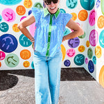 Lightweight cotton blue and white striped flutter sleeve top with button down front and green trim at the collar and placket.