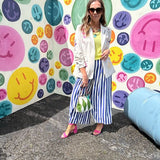 Lightweight white blazer with multi colored cowboy boots throughout and side pockets with lapel collar.