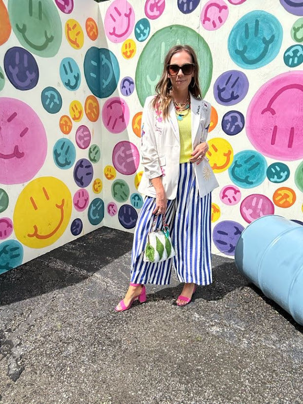 Lightweight white blazer with multi colored cowboy boots throughout and side pockets with lapel collar.