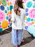Cream fitted blazer with vibrant floral embroidery and French embroidered —"j'taime," "amour," "bisou, bisou"—with structured shoulder padding and scrunched sleeves.