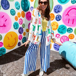 Lightweight white blazer with multi colored cowboy boots throughout and side pockets with lapel collar.