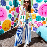 Lightweight white blazer with multi colored cowboy boots throughout and side pockets with lapel collar.