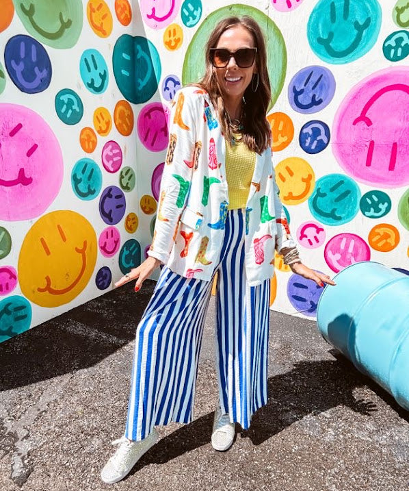 Lightweight white blazer with multi colored cowboy boots throughout and side pockets with lapel collar.