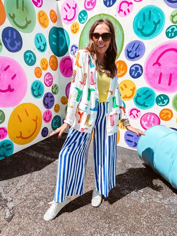 Lightweight white blazer with multi colored cowboy boots throughout and side pockets with lapel collar.