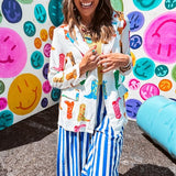 Lightweight white blazer with multi colored cowboy boots throughout and side pockets with lapel collar.