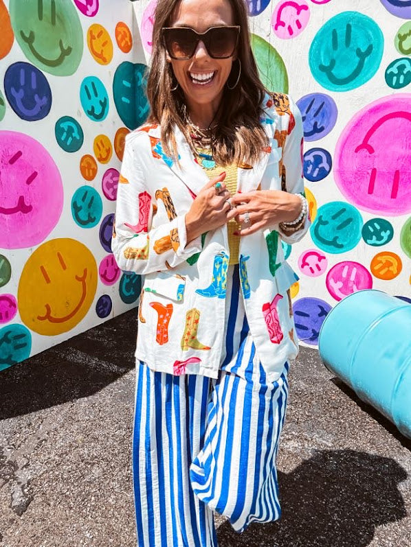 Lightweight white blazer with multi colored cowboy boots throughout and side pockets with lapel collar.
