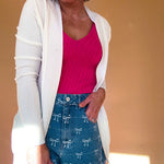 Lightweight, open front cardigan with wide ribbed trim and cuffs and pockets.