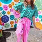Cotton terry wide leg pants in mineral washed bubble gum pink with elastic drawstring waist, oversized pockets and raw seams.