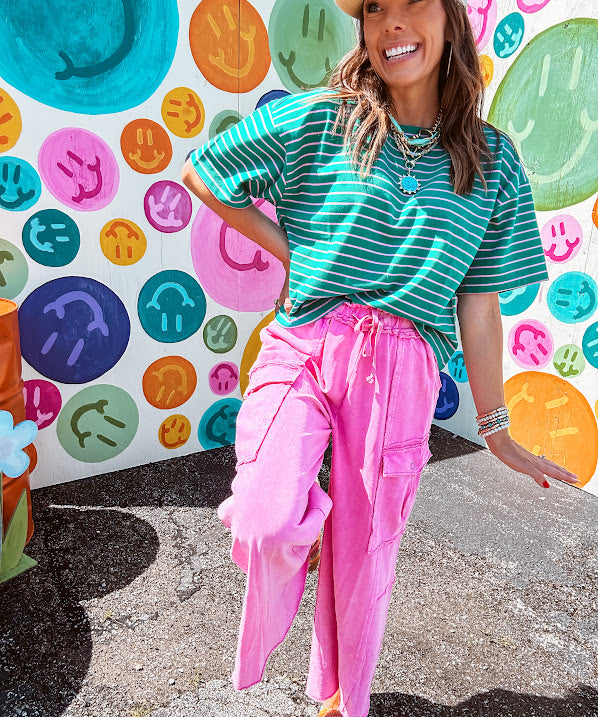 Cotton terry wide leg pants in mineral washed bubble gum pink with elastic drawstring waist, oversized pockets and raw seams.