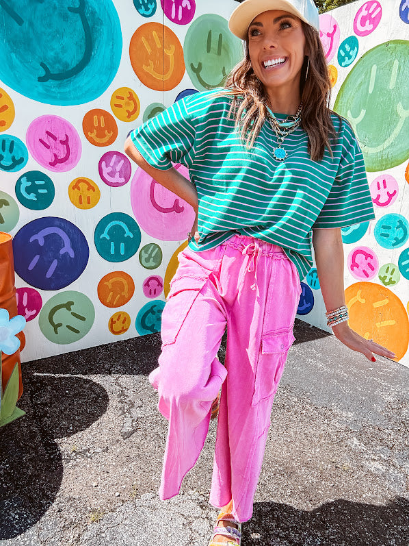 Cotton terry wide leg pants in mineral washed bubble gum pink with elastic drawstring waist, oversized pockets and raw seams.