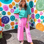 Cotton terry wide leg pants in mineral washed bubble gum pink with elastic drawstring waist, oversized pockets and raw seams.