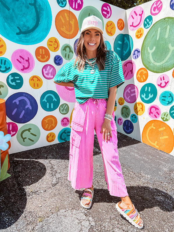 Cotton terry wide leg pants in mineral washed bubble gum pink with elastic drawstring waist, oversized pockets and raw seams.