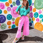 Cotton terry wide leg pants in mineral washed bubble gum pink with elastic drawstring waist, oversized pockets and raw seams.