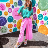 Cotton terry wide leg pants in mineral washed bubble gum pink with elastic drawstring waist, oversized pockets and raw seams.