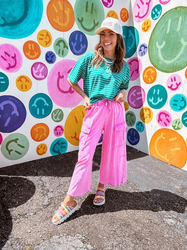 Cotton terry wide leg pants in mineral washed bubble gum pink with elastic drawstring waist, oversized pockets and raw seams.