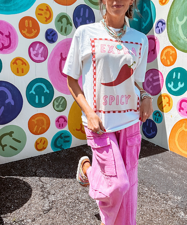 Washed white tee with pink and red checkered graphic paired with a fiery pepper design.