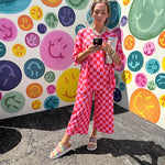 Soft, stretchy ribbed textured set in pink and red checkers with an oversized short sleeved round neck top and matching elastic waist, wide leg bottoms.