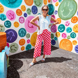 Soft, stretchy ribbed textured set in pink and red checkers with an oversized short sleeved round neck top and matching elastic waist, wide leg bottoms.