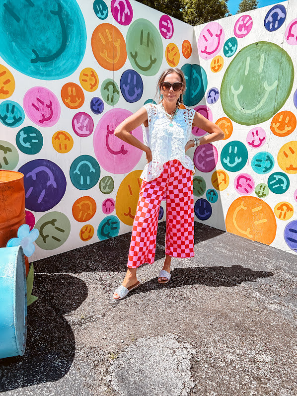 Soft, stretchy ribbed textured set in pink and red checkers with an oversized short sleeved round neck top and matching elastic waist, wide leg bottoms.