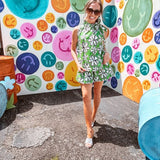Cotton A line tank with drawstring neckline with tie in green with black and white abstract florals throughout.