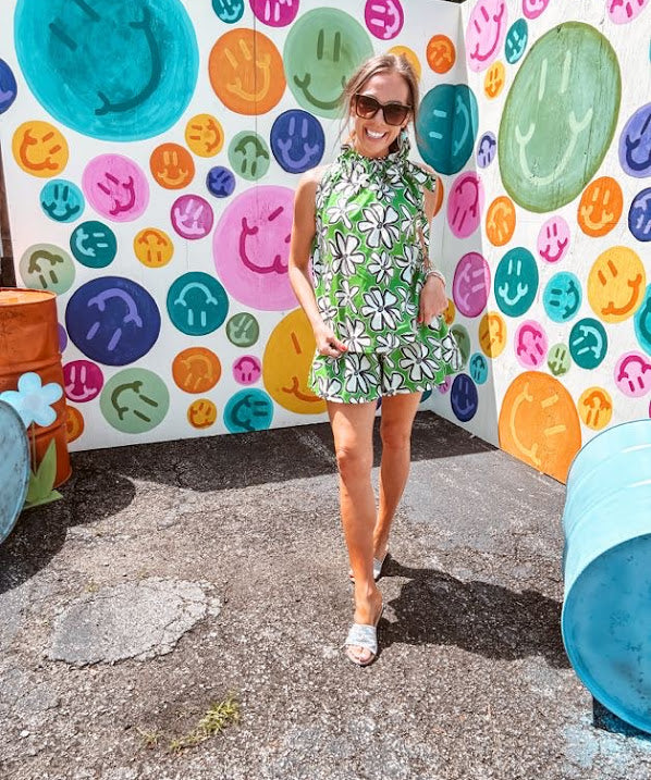 Cotton A line tank with drawstring neckline with tie in green with black and white abstract florals throughout.