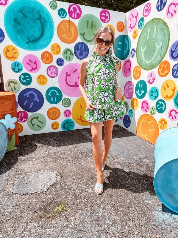Cotton A line tank with drawstring neckline with tie in green with black and white abstract florals throughout.