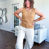 Soft waffle textured knit tank top with round neck and wide hem.