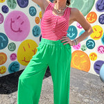 Linen and cotton blend flowy wide leg pants with elastic waist, pockets and frayed hem and pockets.