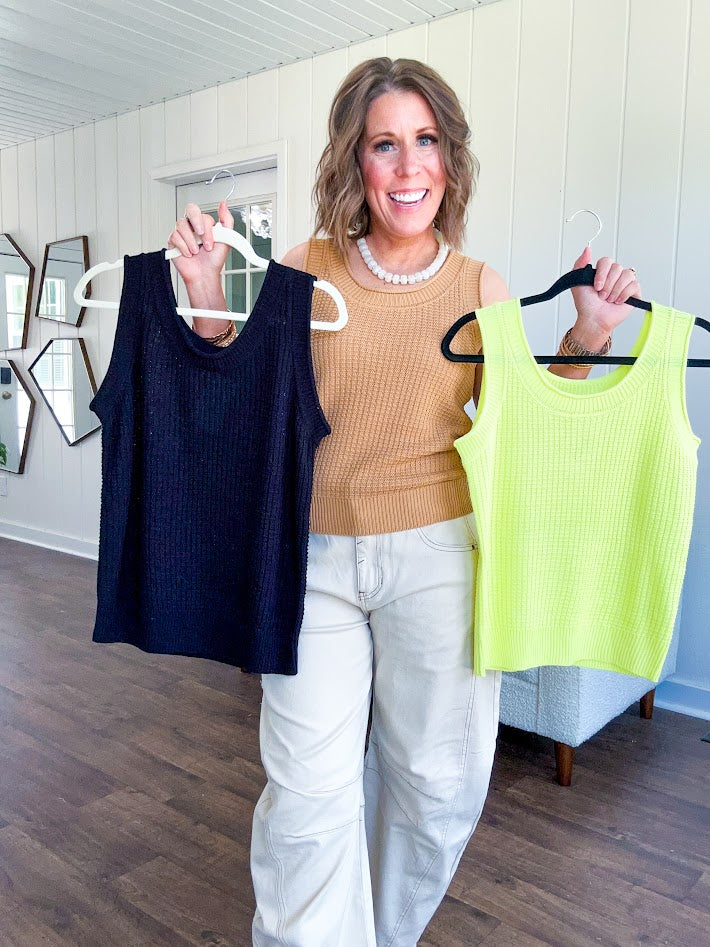 Soft waffle textured knit tank top with round neck and wide hem.