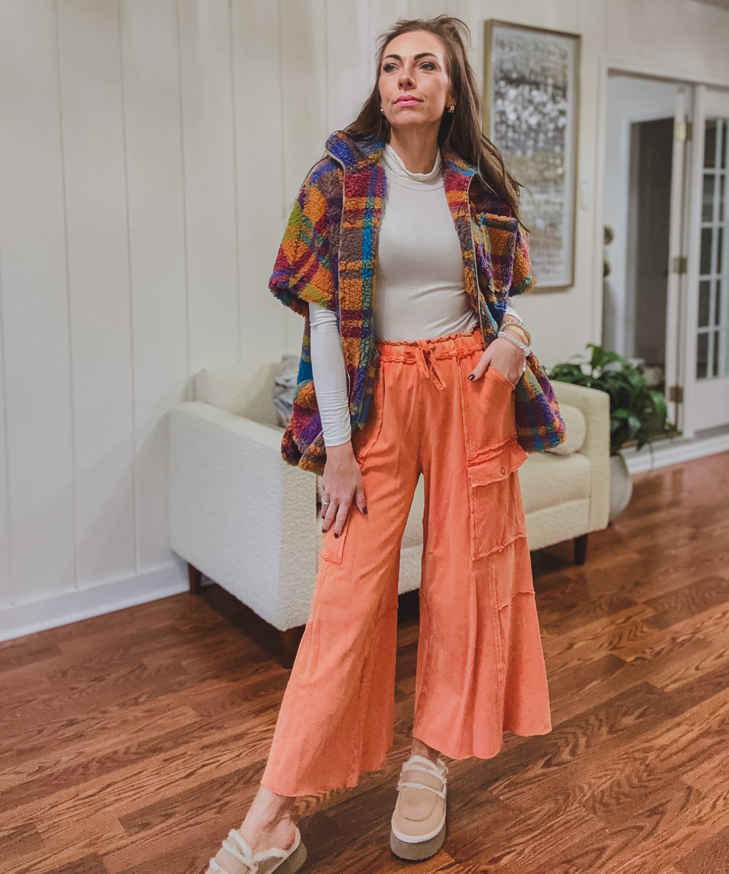 Terry-like cotton wide leg pants in a bold rust orange washed design with oversized pockets, raw hems and drawstring waist.