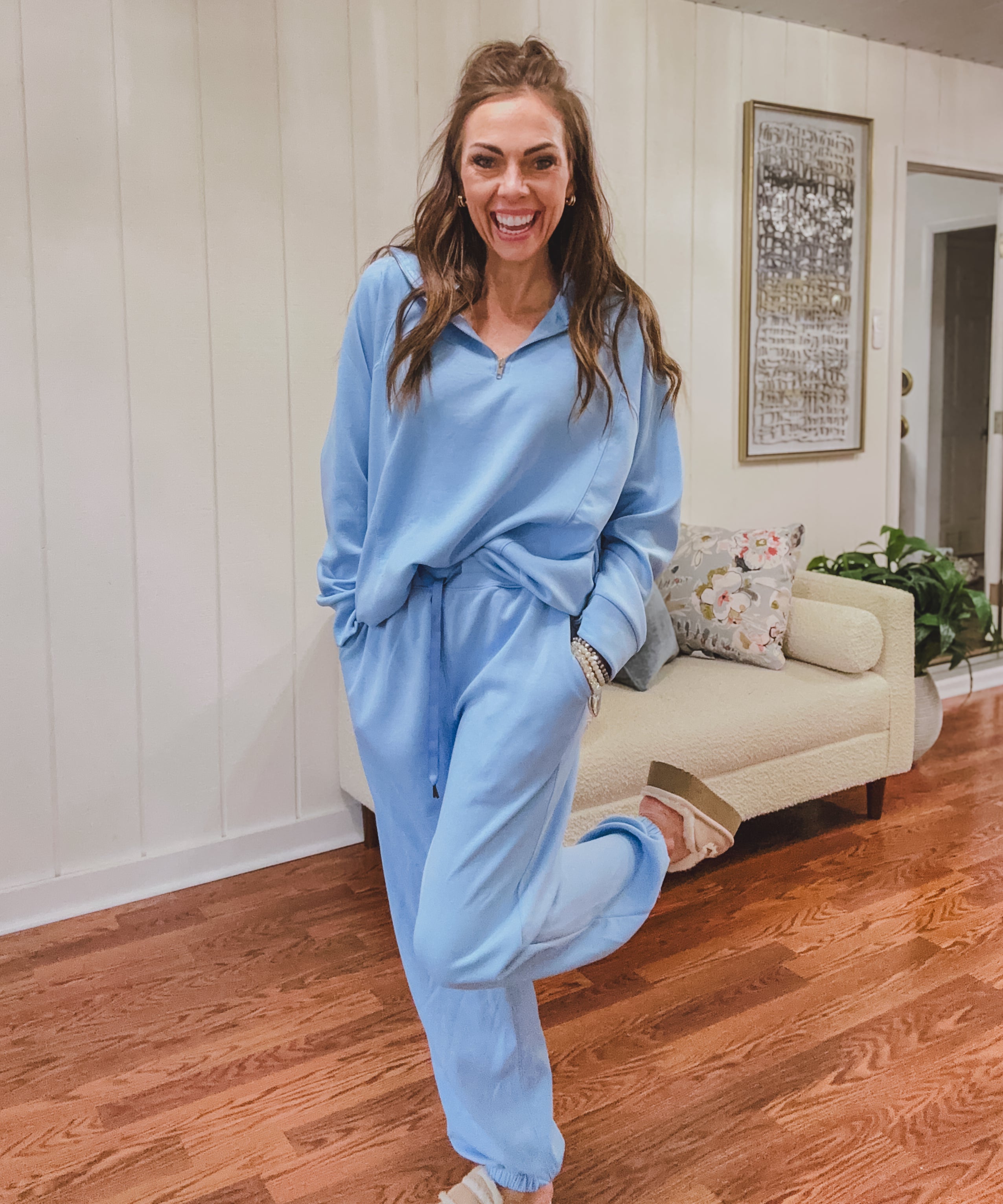 Light blue travel set with 1/4 zip top and elastic waist and cuffs on the pants.