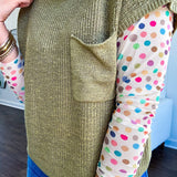 Lightweight dolman style cropped knit sweater with short sleeves, front pocket and available in three colors.