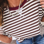 Terry-like short sleeved top with dark brown and cream stripes, split hem and maroon trim at the round neck.