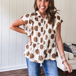 Lightweight and flowy cream top with khaki polka dots throughout with flutter sleeve 3/4 button down front and ruffle hem with pintucking down the placket.